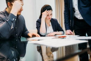 man and woman discussing paperwork and rights