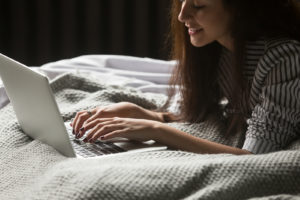woman typing on computer