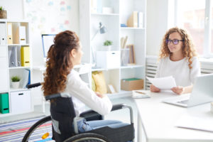 woman discussing accessibility rights with lawer