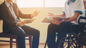 man discussing medical rights with lawyer