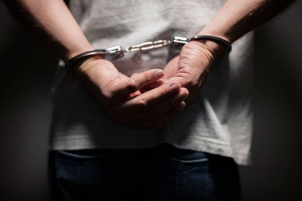 man in handcuffs, false arrest