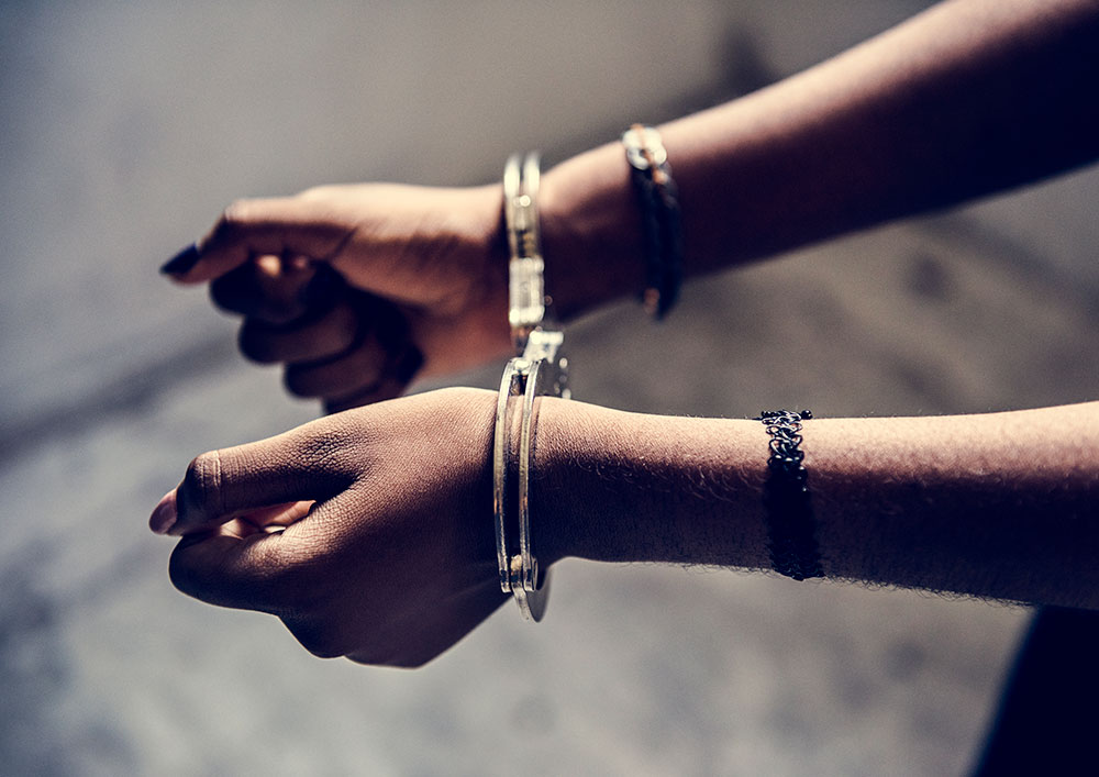 black woman in handcuffs