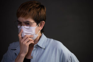 female employee wearing mask during coronavirus outbreak