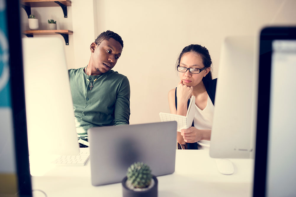 woman and man working together