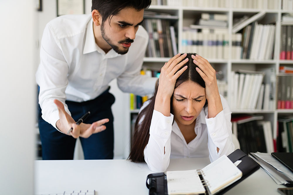 male coworker yelling at woman, employee rights