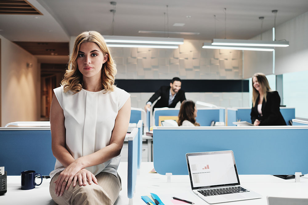 woman isolated at office, employee rights, sexist language