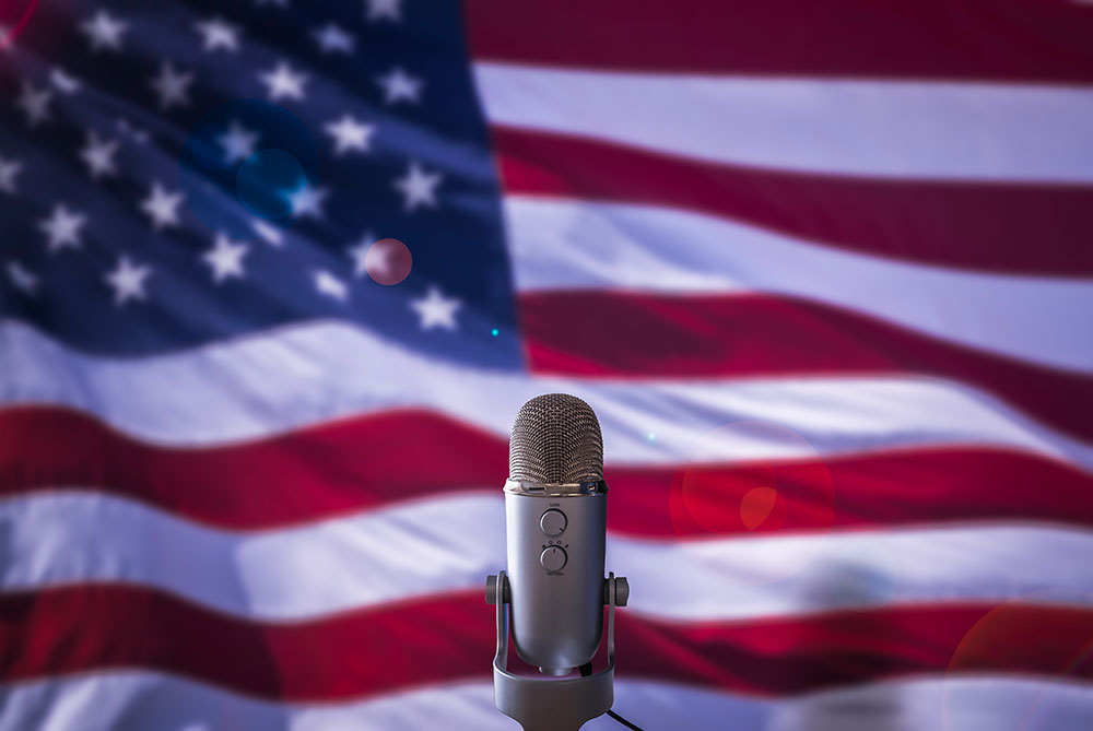 microphone in front of american flag, freedom of speech