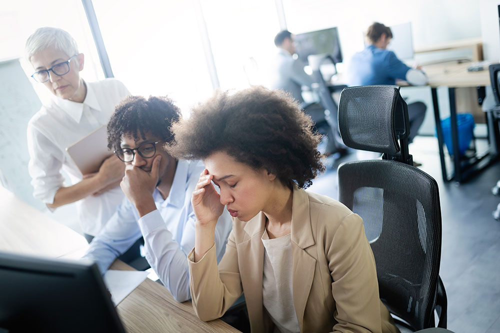 woman stressed at work, workplace discrimination