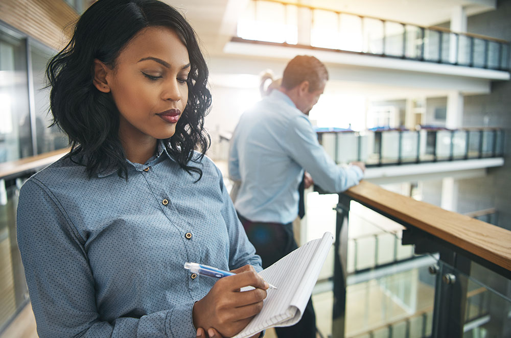 black woman worried at office, racial discrimination