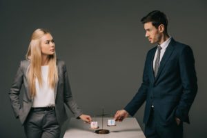woman and man demonstrating equality, equal pay
